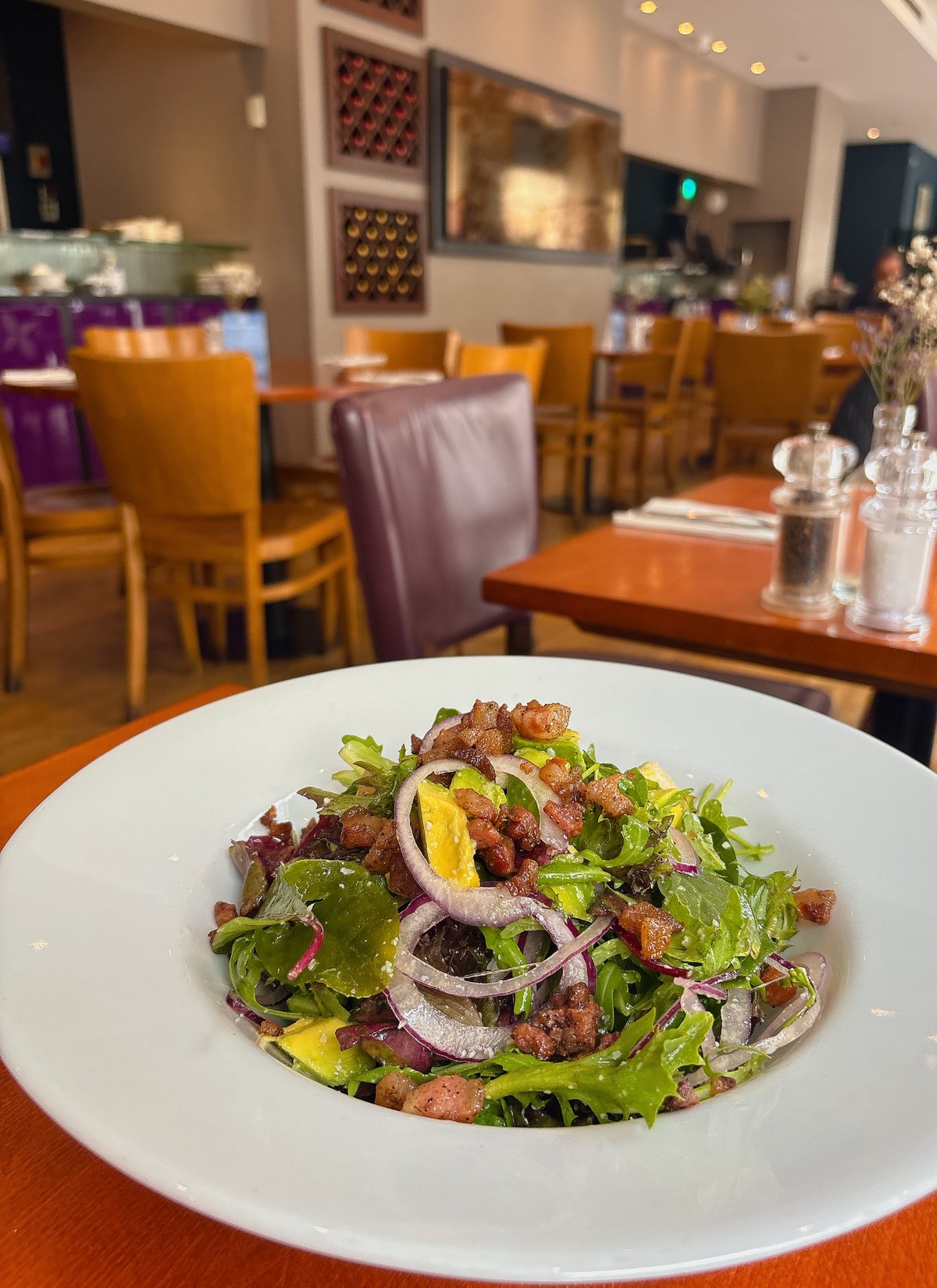 Insalate Locale: Chopped avocado, gorgonzola, pancetta, red onion, mixed leaves.