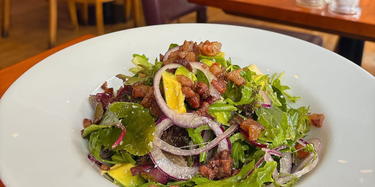 Insalate Locale: Chopped avocado, gorgonzola, pancetta, red onion, mixed leaves.